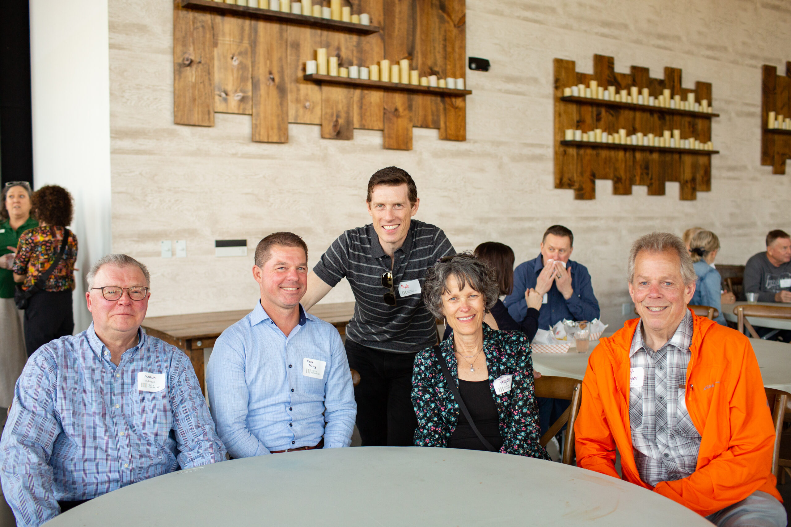 Financial advisors, Matthew Nelson (center) and Matthew Finley (second from left) catching up with clients during Shred-It Client Event at Forgotten Star Brewery.
