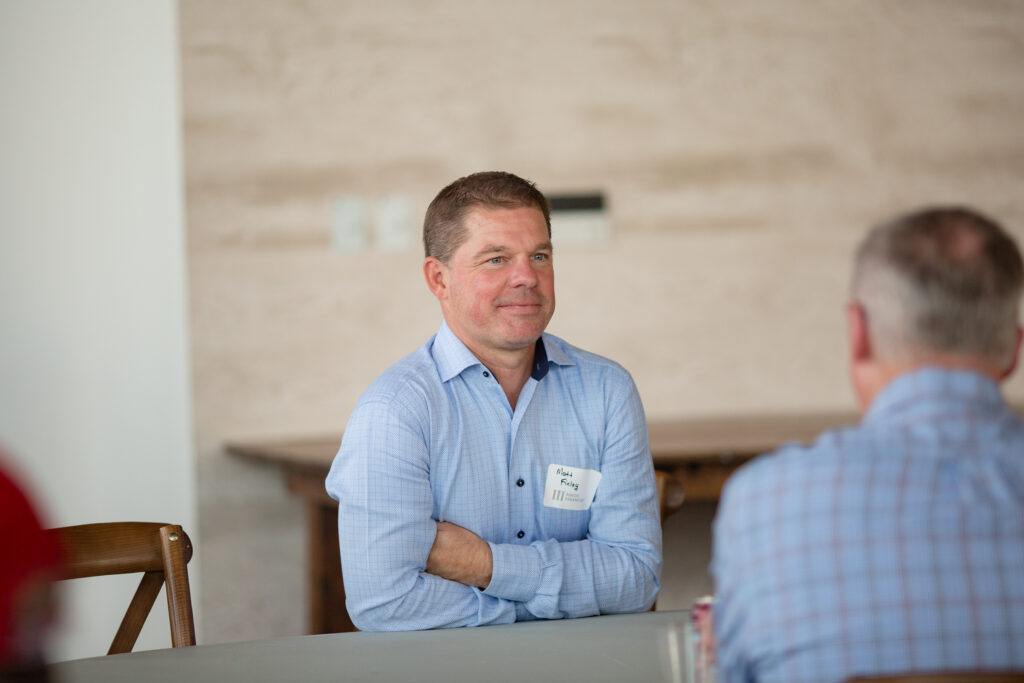 Perspective 6 partner and advisor seen smiling in discussion with clients